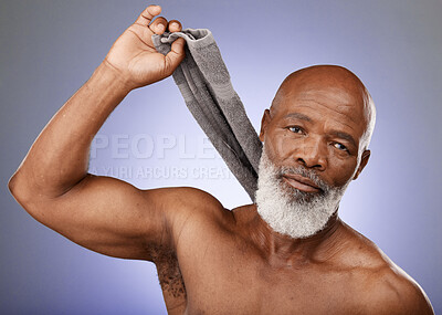 Buy stock photo Shower, cleaning and senior black man grooming, hygiene and body wellness from a spa sauna on a purple background in studio. Retirement glow, self care and portrait of an elderly model from bathroom