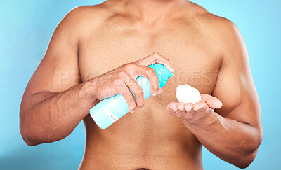Buy stock photo Shaving cream, hand and man with foam for hair removal, grooming or epilation in a studio. Product, skincare and closeup of mousse to shave a facial beard or body hair isolated by a blue background.