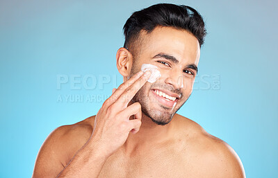 Buy stock photo Cream, face and skincare man in studio for beauty, cosmetics and product promotion mockup with smile happy for benefits. Skin care, dermatology and young model with sunscreen application in portrait