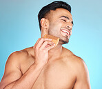 Beauty, brush and man comb beard for facial hair care maintenance, self care grooming or daily wellness treatment. Spa salon, healthcare and model with combing product isolated on blue background