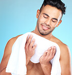 Cleaning, towel and face of man clean after wellness wash, facial cleaning routine and skincare mockup. Happiness, smile and person after bath or shower for body self car on blue studio background