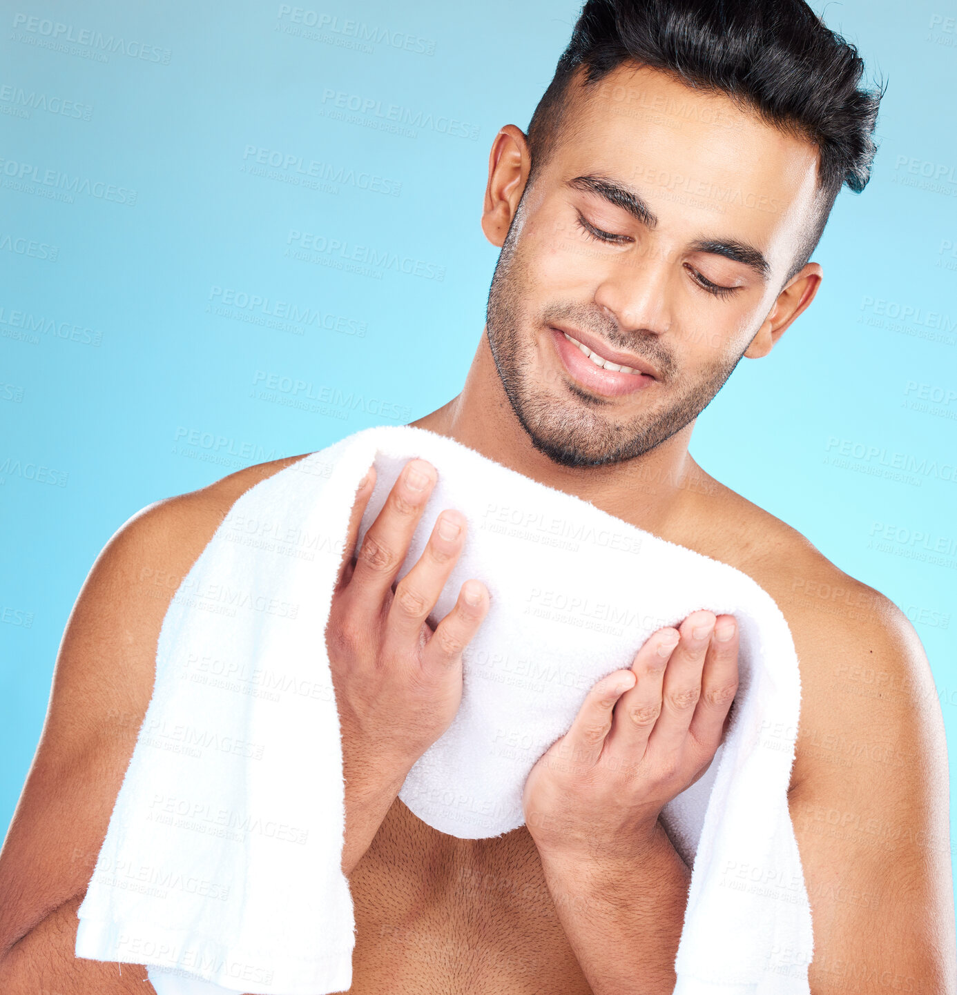 Buy stock photo Cleaning, towel and face of man clean after wellness wash, facial cleaning routine and skincare mockup. Happiness, smile and person after bath or shower for body self car on blue studio background