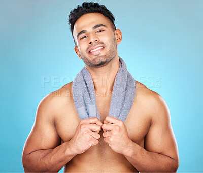 Buy stock photo Man, shower towel or self care grooming on blue background studio in healthcare wellness, body cleaning or skincare hygiene. Portrait, smile or happy Brazilian model with bathroom spa or sauna fabric