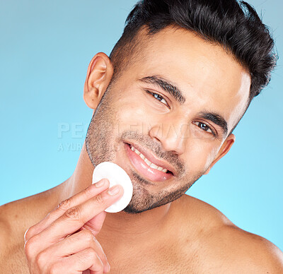 Buy stock photo Cotton, skincare and man in studio for face glow, shine and beauty product promotion, marketing or advertising benefits. Happy portrait, skin care model and facial cleaning wipe in dermatology health