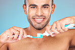 Portrait, man and brushing teeth with toothpaste, toothbrush and dental wellness for healthy lifestyle, cleaning or cosmetics on blue background in Turkey. Happy male model, oral mouth care and smile