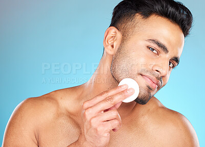 Buy stock photo Beauty, skincare and cotton with portrait of man for facial, product and spa cosmetics. Massage, luxury and cleaning with face of model for toner, makeup remover and self care in blue background