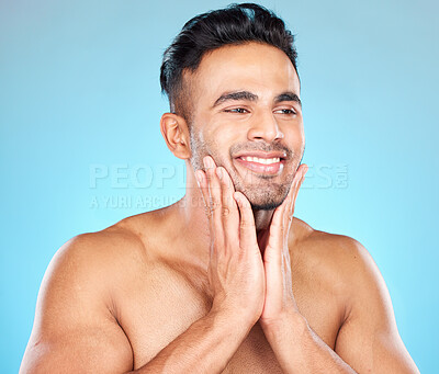 Buy stock photo Man, face and hands for skincare happiness, beauty wellness and smile for cosmetics makeup in studio. Facial care treatment, beard and luxury dermatology or natural skin glow in blue background
