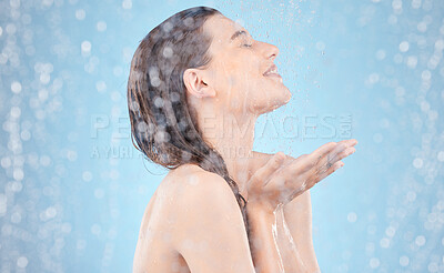 Buy stock photo Woman, water splash and showering in skincare grooming, hygiene maintenance and healthcare wellness on blue background. Smile, happy and washing beauty model in wet cleaning for dermatology self care