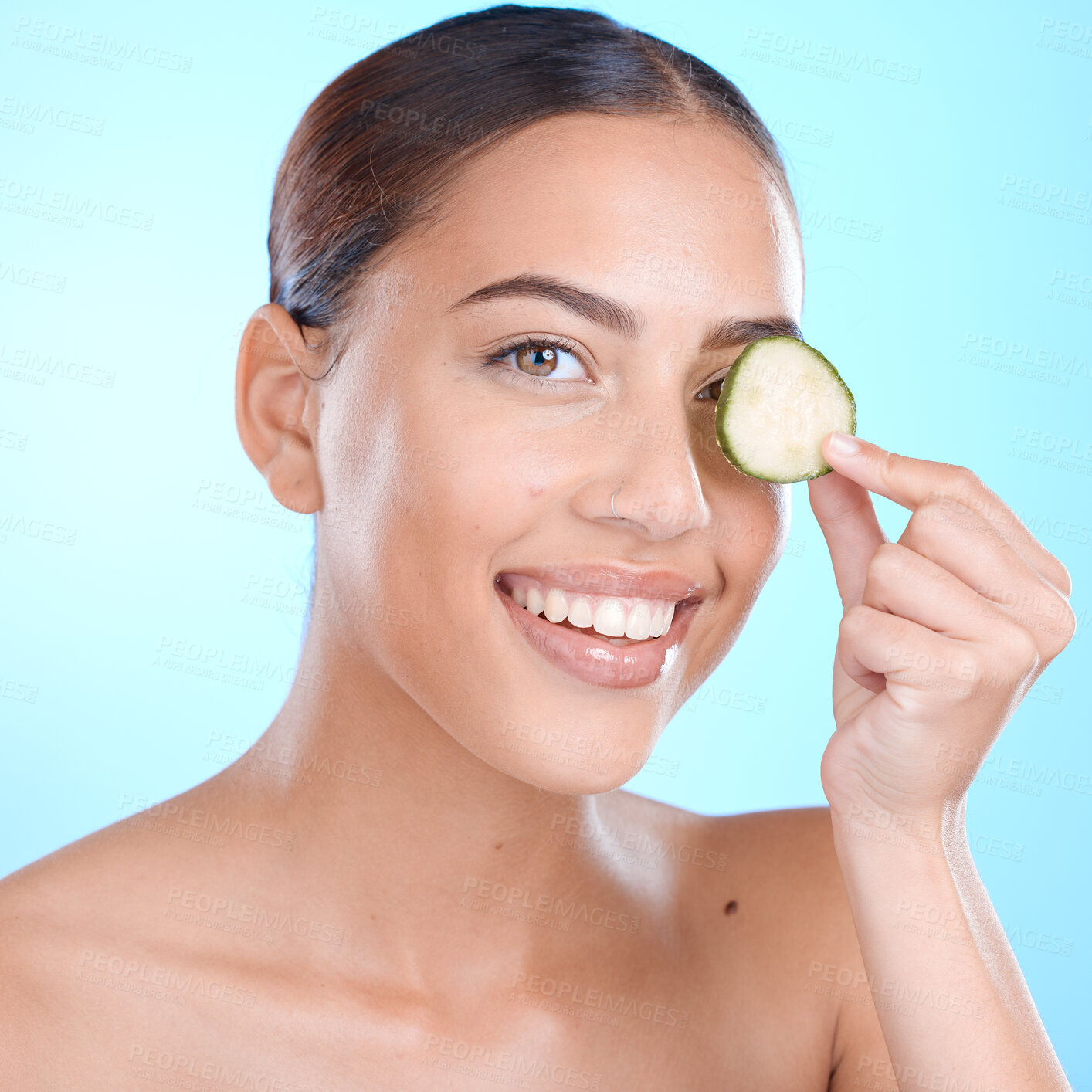 Buy stock photo Face, cucumber and facial skincare, happy smile and vegan or healthy product marketing or advertising space. Happy model with vitamin c fruits for skin care glow, happiness and self care for skin