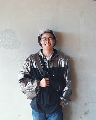 Buy stock photo portrait young asian man student smiling wearing silver jacket with concrete wall background