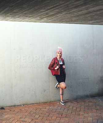 young punk girl student with pink hair looking confident woman alternative fashion style on leaning on concrete wall in city