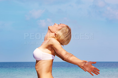Buy stock photo Freedom, travel and beach with a woman on vacation in summer with happiness, energy and a blue sky to relax and breathe ocean air. Young female outdoor in nature for tropical holiday by sea for peace