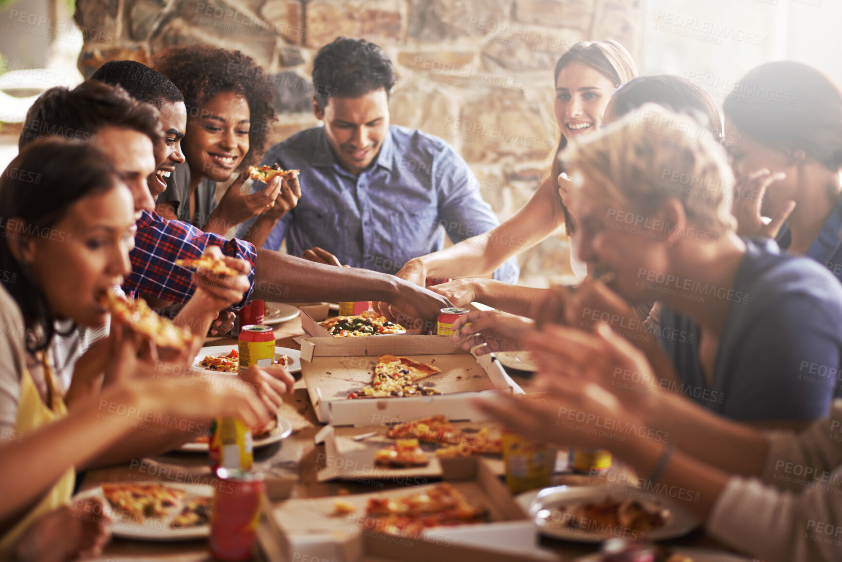 Buy stock photo Pizza, dinner party and friends at a restaurant together feeling happy about social celebration. Diversity, food and lens flare of people eating fast food at dinner talking and speaking at a table