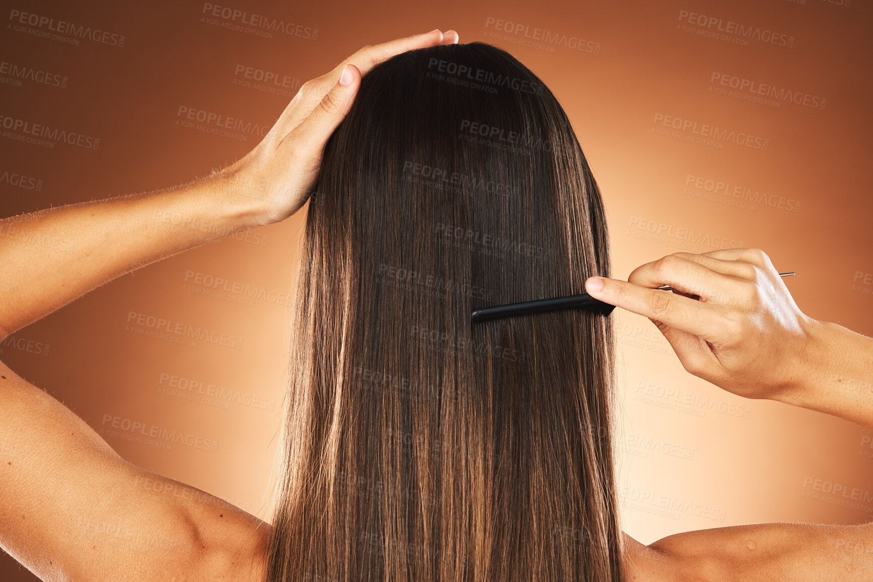 Buy stock photo Hair care, salon and back of woman brushing hair, healthy beauty and comb hairstyle against a brown studio background. Wellness, morning routine and model with straight hair treatment for haircare