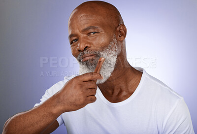 Buy stock photo Face, senior man and beard comb in studio isolated on a purple background. Portrait, retirement and hair care of elderly black man holding facial hair product for grooming, fresh hygiene and wellness