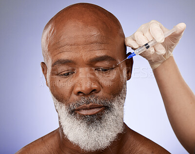 Buy stock photo Hand, face and botox with a senior black man getting a syringe injection in studio on a purple background. Plastic surgery, anti aging and treatment with a mature male in a salon for a facelift