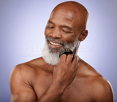 Buy stock photo Beauty, brush and grooming with black man and beard for hair care, style or barber. Self care, hygiene and growth with face of old man for natural, product and luxury ion purple background in studio