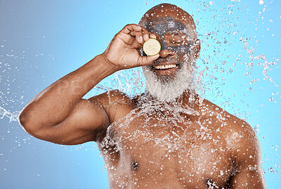 Buy stock photo Facial, water splash and black man in studio for skincare, beauty and wrinkles treatment on blue background. Face, skin and mask product on senior man relax with splash, cosmetics and cleaning