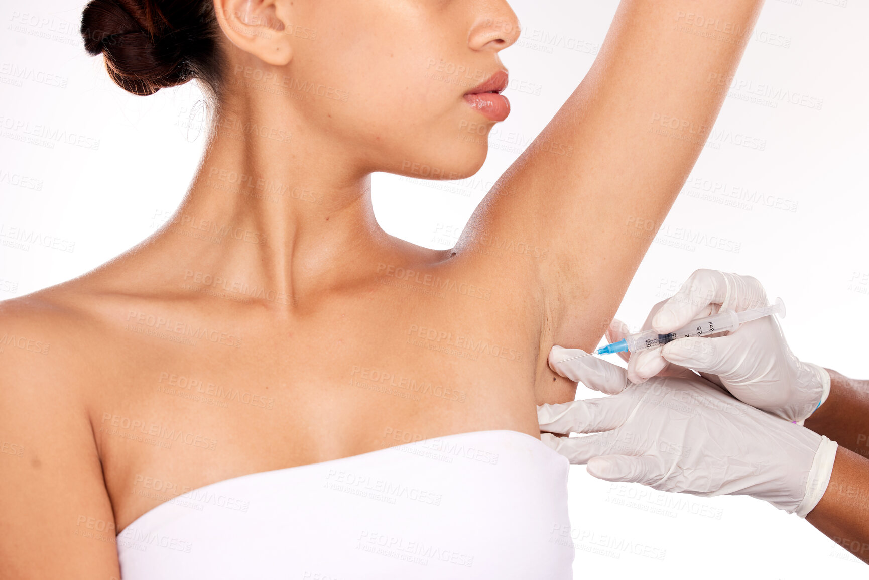 Buy stock photo Beauty, armpit and injection for wellness aesthetic and professional treatment of hyperhidrosis. Plastic surgery doctor with cosmetic under arm botox syringe for girl patient in white studio.

