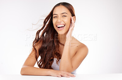 Buy stock photo Beauty, skincare and woman in studio with hair care, cosmetics and natural makeup on white background or marketing space. Happy, portrait and teeth of young model for beauty salon mockup advertising