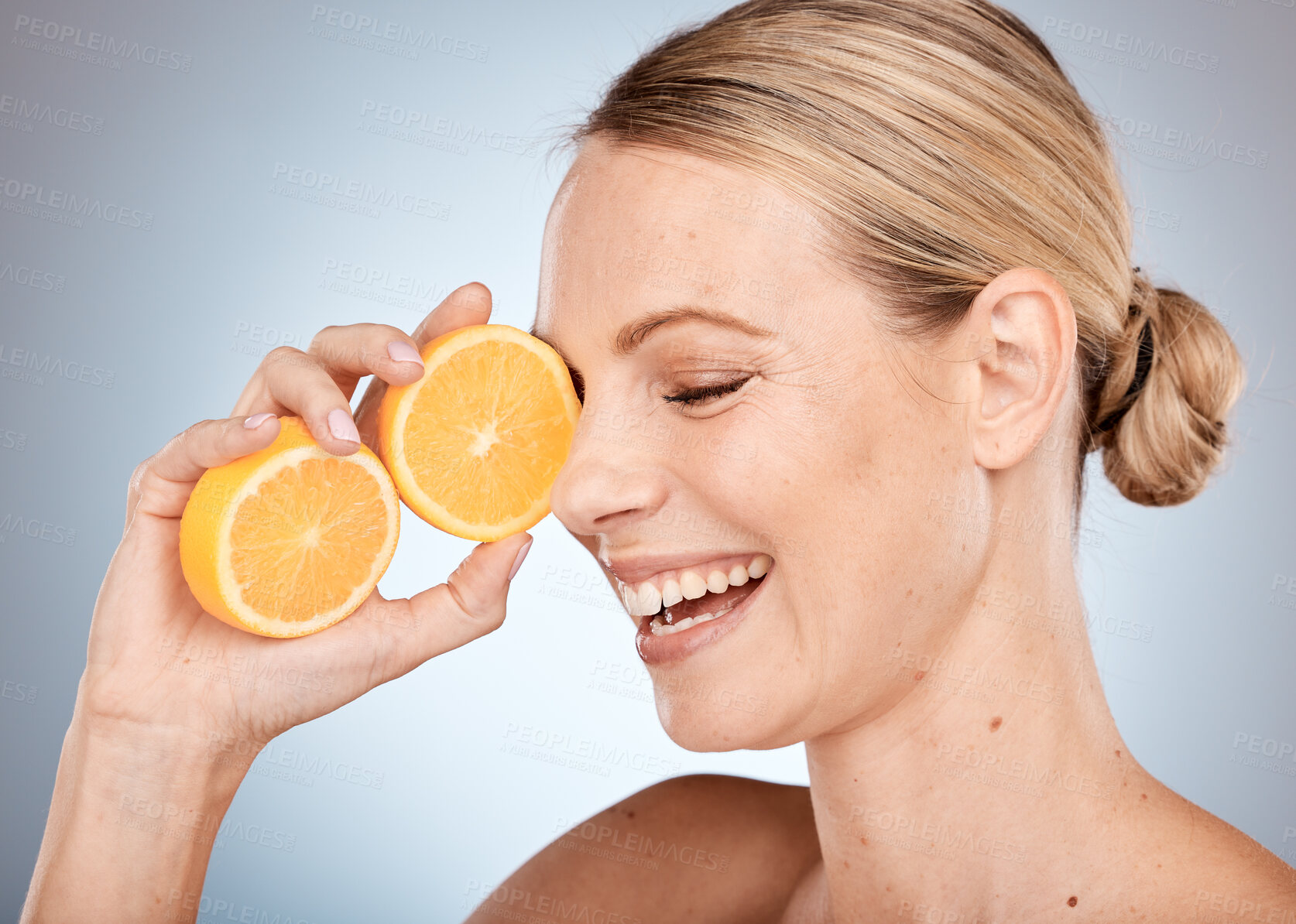 Buy stock photo Skincare, beauty and woman with orange in studio for spa wellness, dermatology and facial treatment. Vitamin c, cosmetics and happy girl with fruit for natural, healthy and organic beauty products