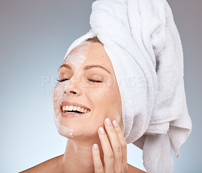 Buy stock photo Skincare, cream and woman from the shower, happy cleaning and marketing beauty against a grey studio background. Spa smile, face mask and model with application of sunscreen for body care and health