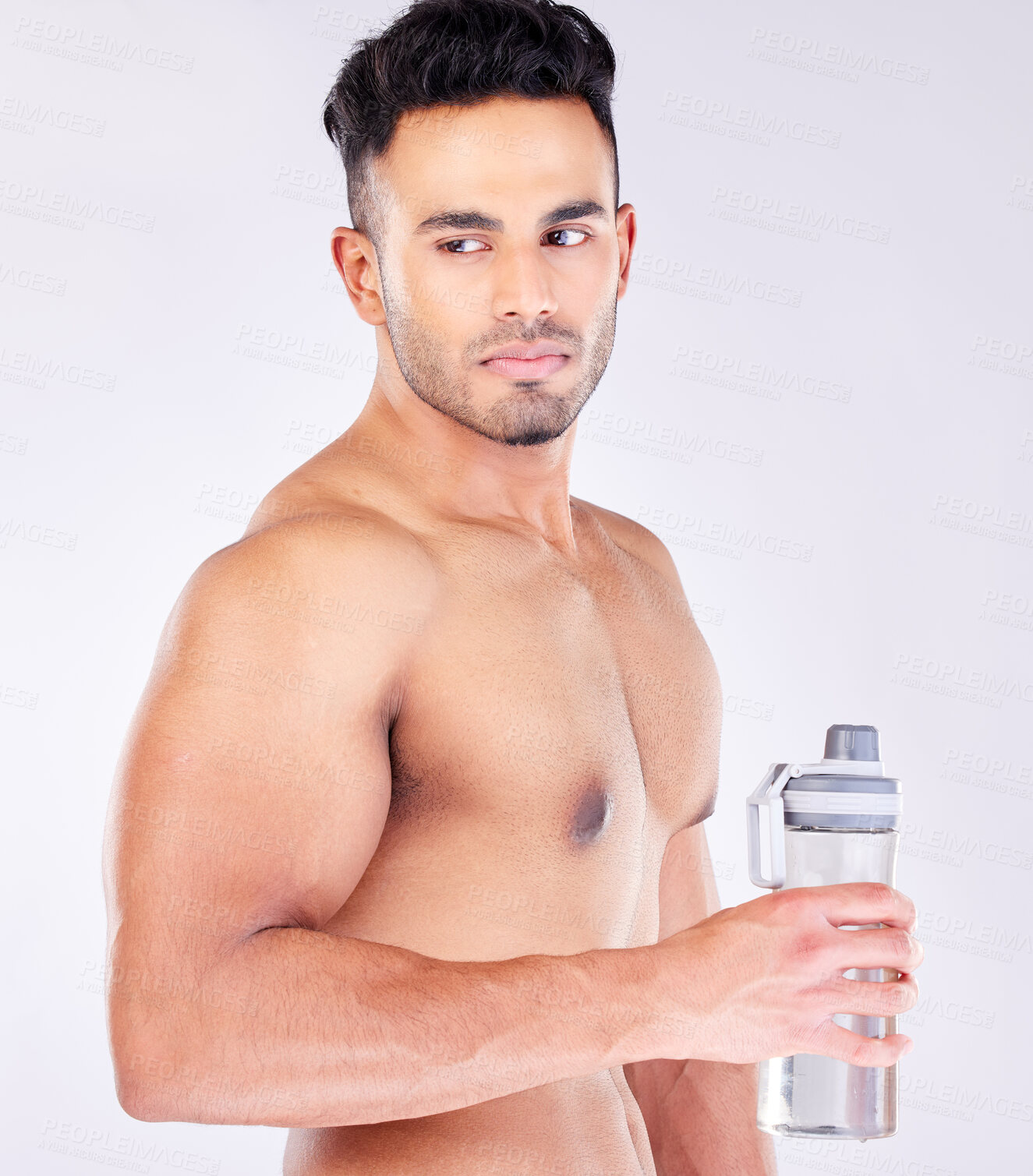 Buy stock photo Fit, strong and workout break and water bottle with a man ready to drink water on a grey studio background. Bodybuilder, drinking water and exercise or training break for thirsty hydration