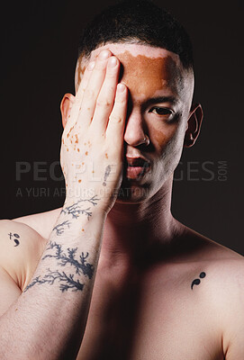 Buy stock photo Man, vitiligo and beauty with hand, face and skincare portrait, dermatology and aesthetic in black studio background. Young male, model and skin pigmentation and body melanin with health in mockup