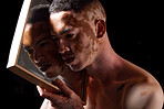 Vitiligo, beauty and mirror for man reflection of skin condition, disorder or problem with dermatology treatment on black studio background. Pigmentation, patches and melanin of male face for art