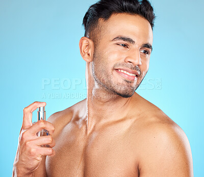 Buy stock photo Man, happy and perfume for fragrance, aroma and manly scent on blue studio background. Young male, healthy Latino gentleman and cologne for natural beauty, fresh and smell good for hygiene and relax