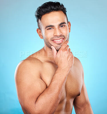 Buy stock photo Portrait, wellness and man with smile, skincare and natural beauty on blue studio background. Latino male, healthy gentleman and cosmetics for body care, confidence and organic facial for face detox.