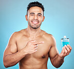 Man, perfume and aftershave bottle for marketing, advertising and mockup for glass container, product placement and cosmetics. Portrait of India model with a smile for parfum, promo and aftershave