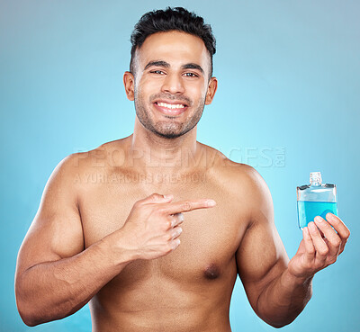 Buy stock photo Man, perfume and aftershave bottle for marketing, advertising and mockup for glass container, product placement and cosmetics. Portrait of India model with a smile for parfum, promo and aftershave