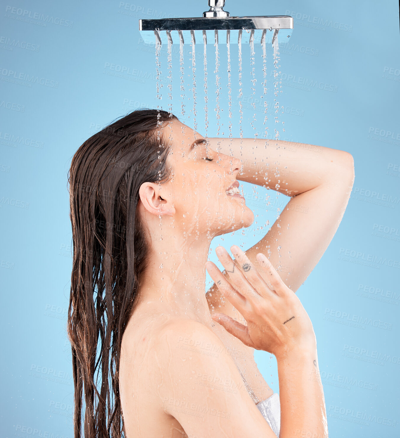 Buy stock photo Woman, shower and water mockup for skincare health, showering for clean skin and natural wellness. Healthy beauty model, happy face and advertising healthcare or hygiene on a studio blue background 
