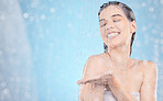 Water, cleaning and mockup with a woman in the shower in studio on a blue background for hygiene or hydration. Health, skincare and steam with an attractive young female washing in the shower