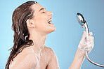 Woman singing in shower, beauty and shower head with hygiene and hair care, cleaning body and girl profile for washing. Skincare, soap foam and happy with wellness and grooming with blue background.
