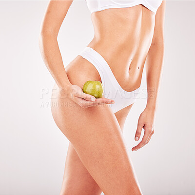 Buy stock photo Skincare, apple and body of woman in lingerie in studio isolated on gray background mockup. Food, underwear and female model holding healthy fruit for diet, nutrition or vitamin c, wellness or beauty