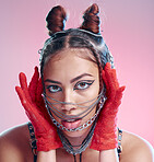 Stylish, goth and portrait of a woman with chains on her face on a pink studio background. Face, headshot and edgy fashion female with chain or metal accessories on her head with cool makeup 
