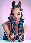 Portrait, front and goth style with a woman posing with metal facial accessories on a pink background. Edgy, trendy and punk fashion with a stylish female posing with face chains on a studio backdrop