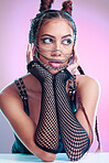 Model, bdsm and sexy clothes with leather, grunge fashion or edgy makeup, jewelry and erotic aesthetic on pink background. Face of girl with chain mask, creative wear and rock cosmetics in studio