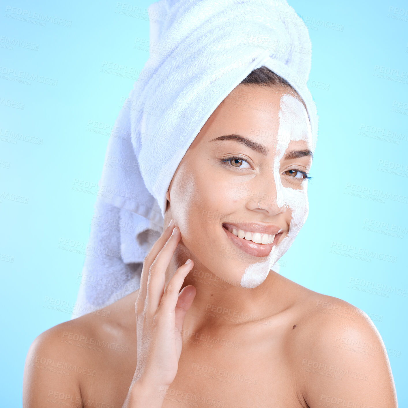 Buy stock photo Skincare, portrait and woman with facial in studio for cleaning, wellness and hair care after shower on blue background. Face, skin and mask product on girl model relax with hydration, cream and care