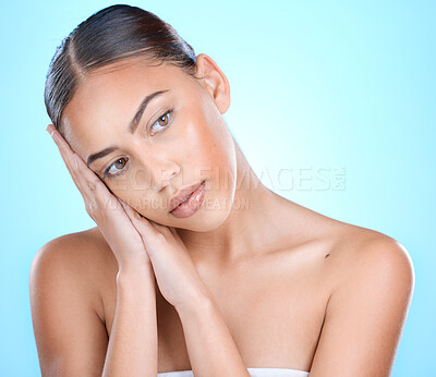 Buy stock photo Beauty, face and makeup, woman and skincare with cosmetics, facial and wellness treatment for skin and healthy glow. Cosmetic mockup, clean and shine with self care against blue studio background.