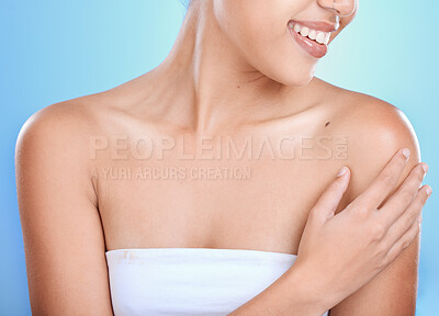 Buy stock photo Skincare, self love and smile of a woman for dermatology, clean body and health against a blue background in studio. Skin beauty, natural self care and happy model with a healthy wellness glow
