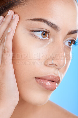 Face, beauty and skincare with a model black woman in studio closeup on a blue background for wellness. Botox, microblading and cosmetics with an attractive young female inside for luxury treatment