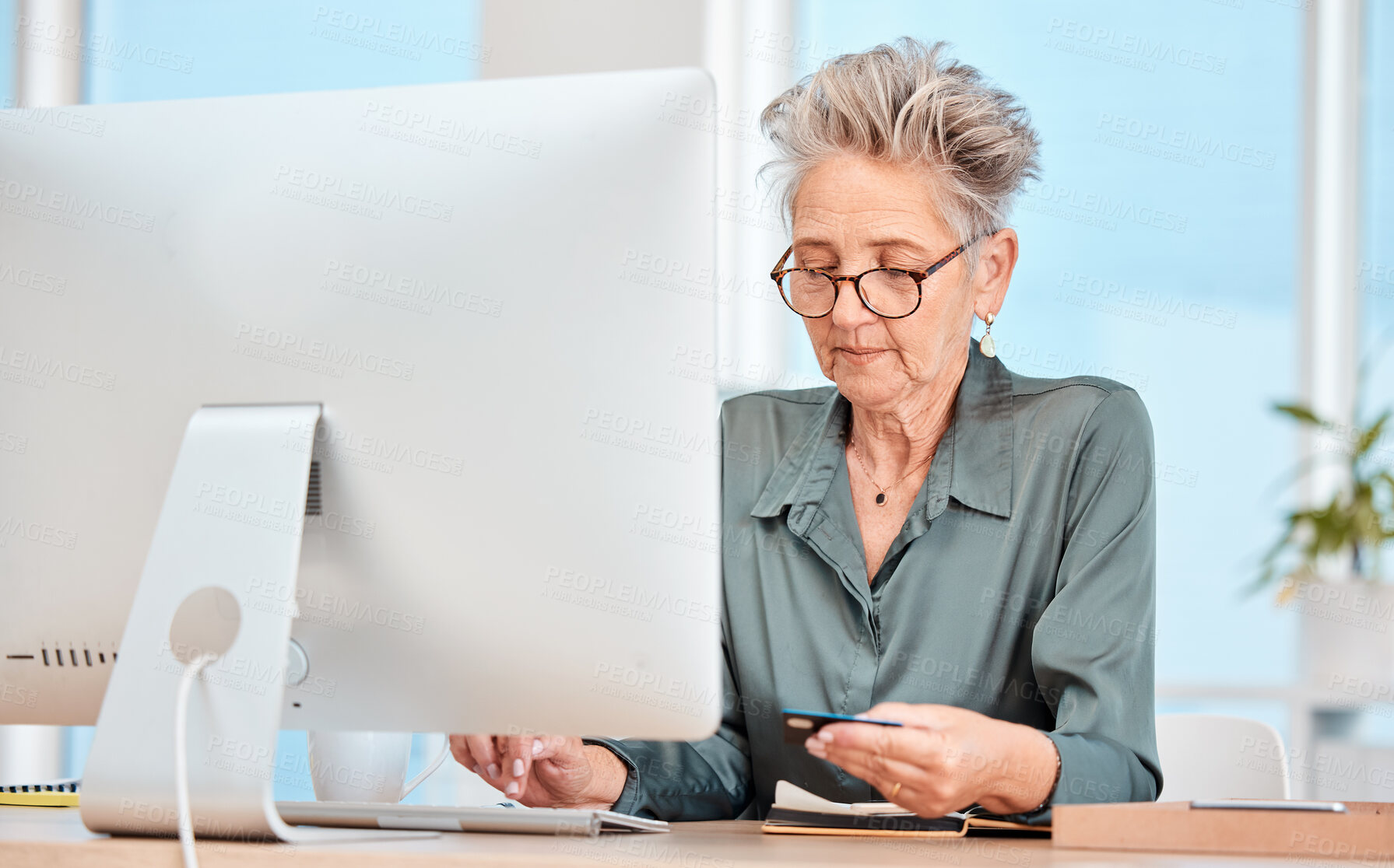 Buy stock photo Business woman, credit card and computer with banking, online shopping and payment for bills on internet in a office. Senior woman, ecommerce and transfer money on pc at desk at her job and web app
