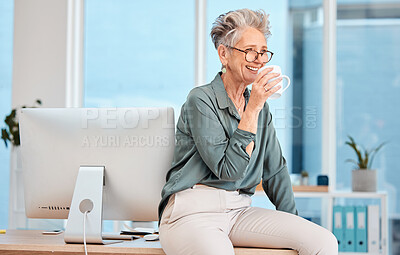 Buy stock photo Happy, coffee and glasses with a female leader, CEO or manager drinking a beverage in a work office. Thinking, management and corporate with a senior business woman sitting on a desk while working