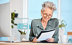 Finance paper, working and business woman writing notes in office, sitting at desk. Ideas, vision or senior woman with pen in hand to write, smile or paperwork, document and financial budget at desk