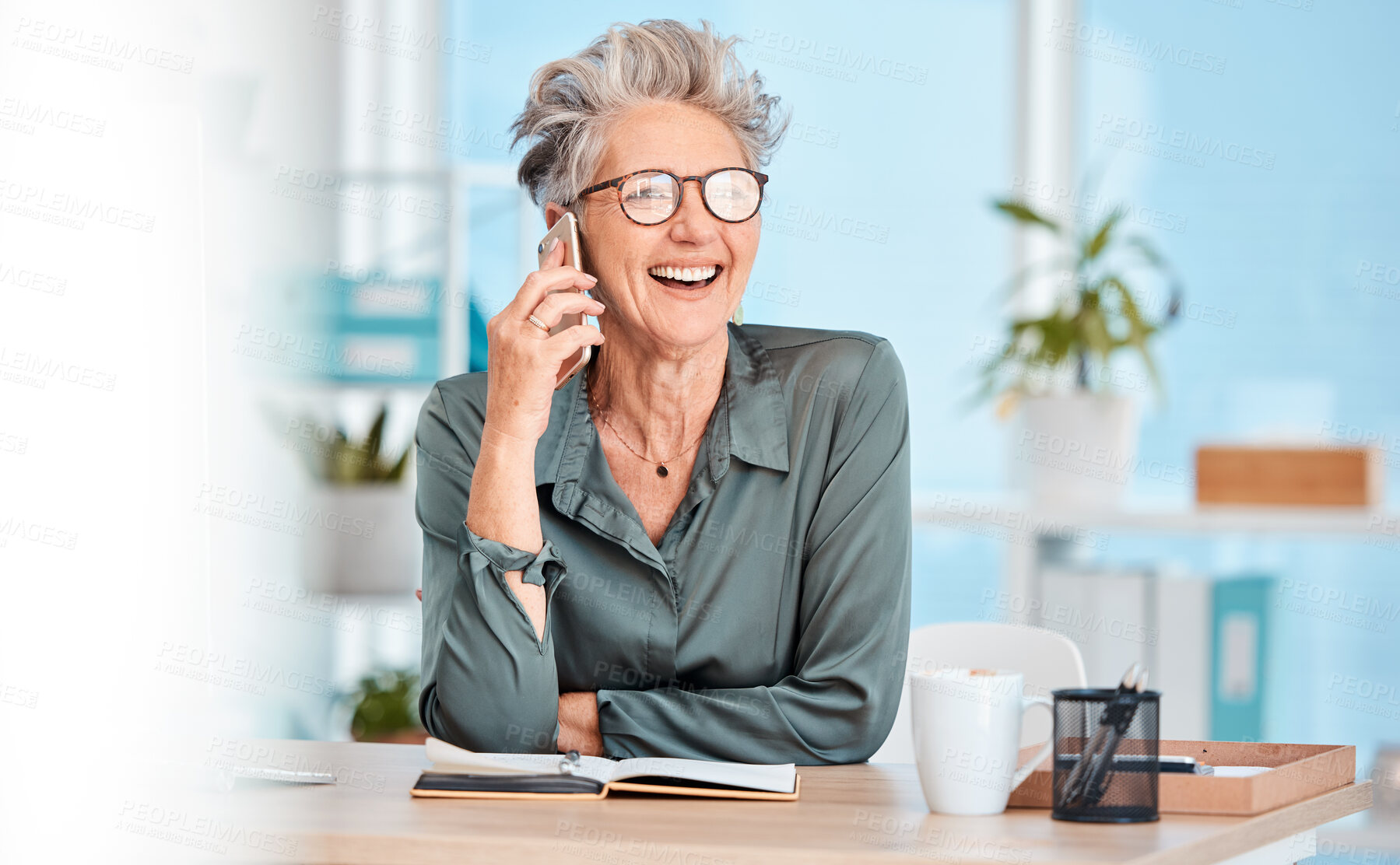 Buy stock photo Phone call, communication and laughing with a senior woman sitting in her office, working alone and networking. Contact, mobile and business with a mature female employee joking while speaking