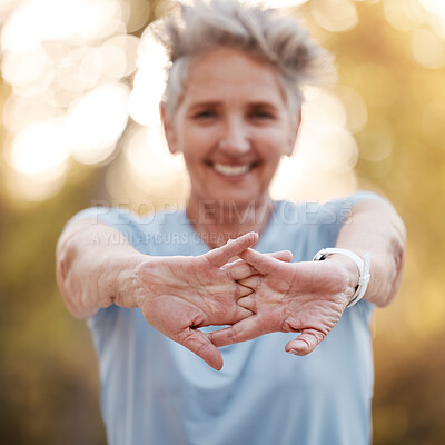 Buy stock photo Senior woman, runner stretching hands in park for running, exercise or wellness with smile. Elderly female training, muscle health and warm up for workout, self care and healthy development outdoor