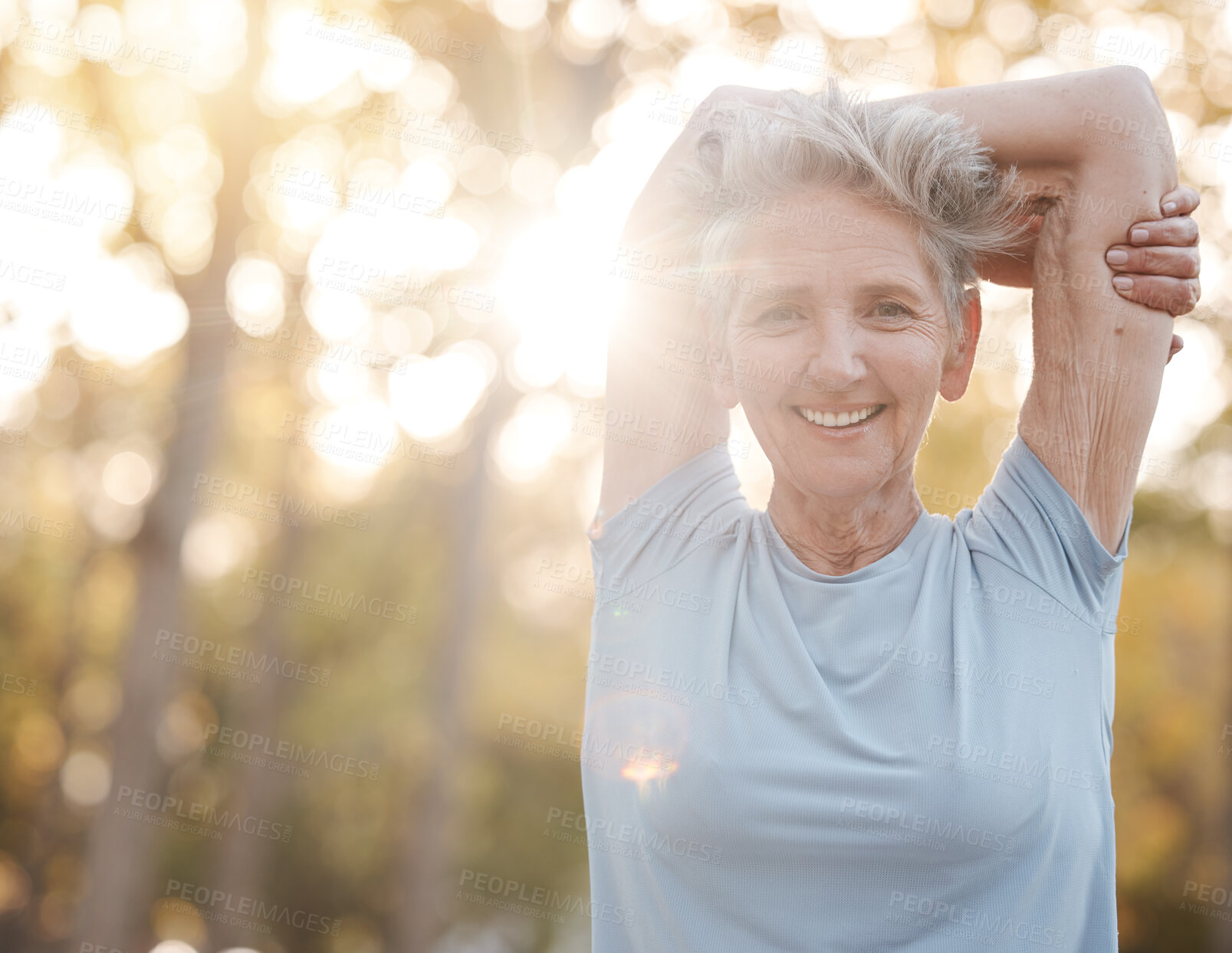 Buy stock photo Fitness, nature and senior woman stretching before an outdoor run or cardio workout with bokeh. Happy, smile and portrait of elderly lady doing warm up exercise before training for a race or marathon